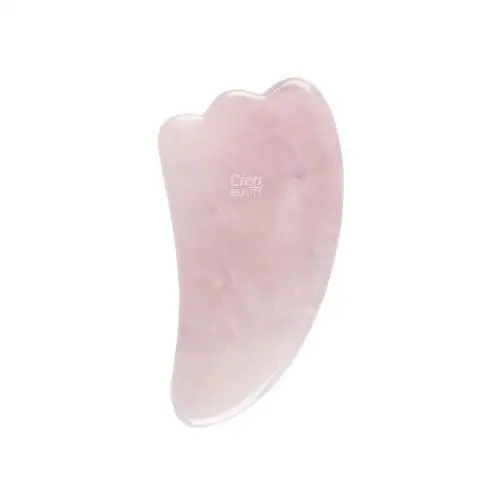 Cien roller do twarzy lub kamień do masażu z różowego kwarcu (kamień do masażu z różowego kwarcu )